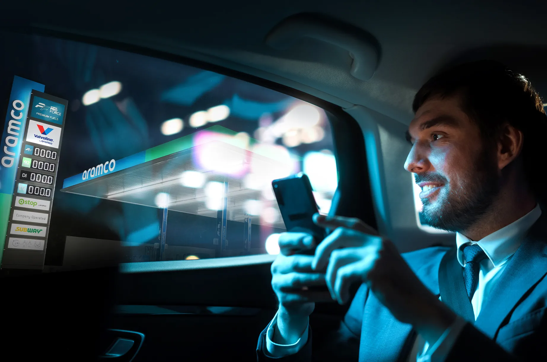 Man holding smartphone in car at night