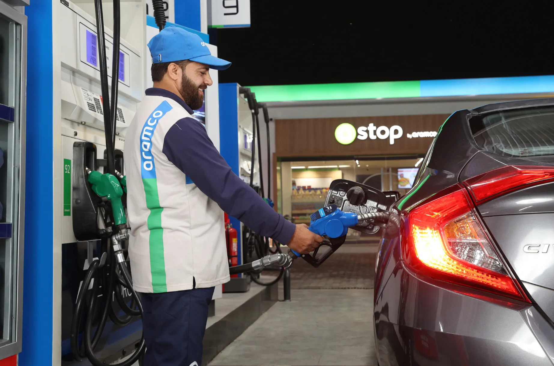 Service attendant refueling a car